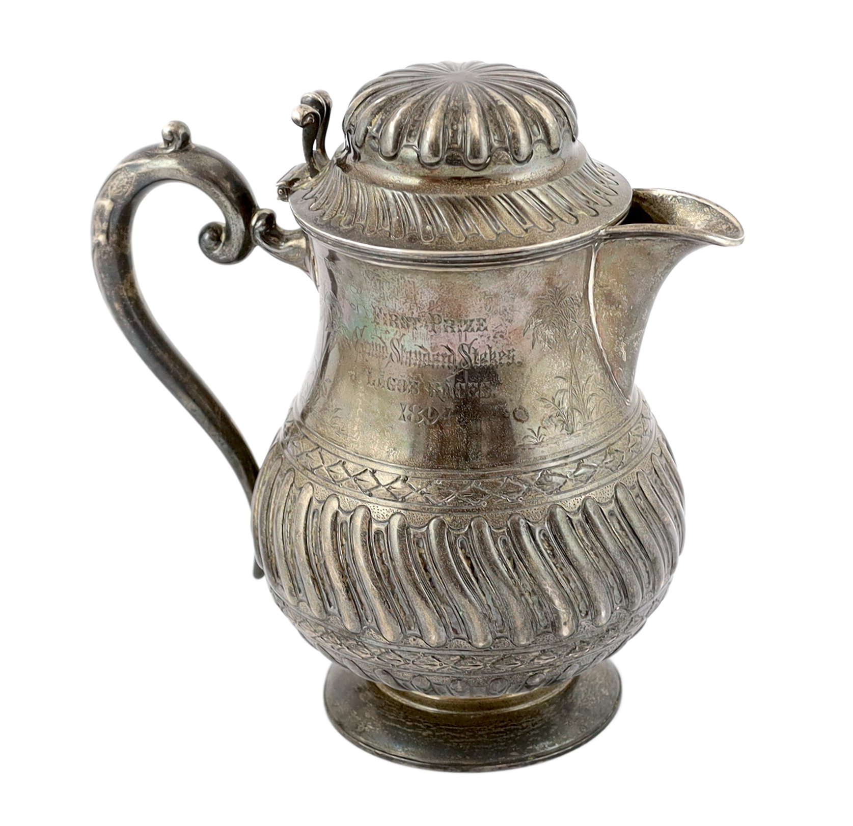 A late Victorian demi fluted wrythened silver water jug, by Mappin & Webb